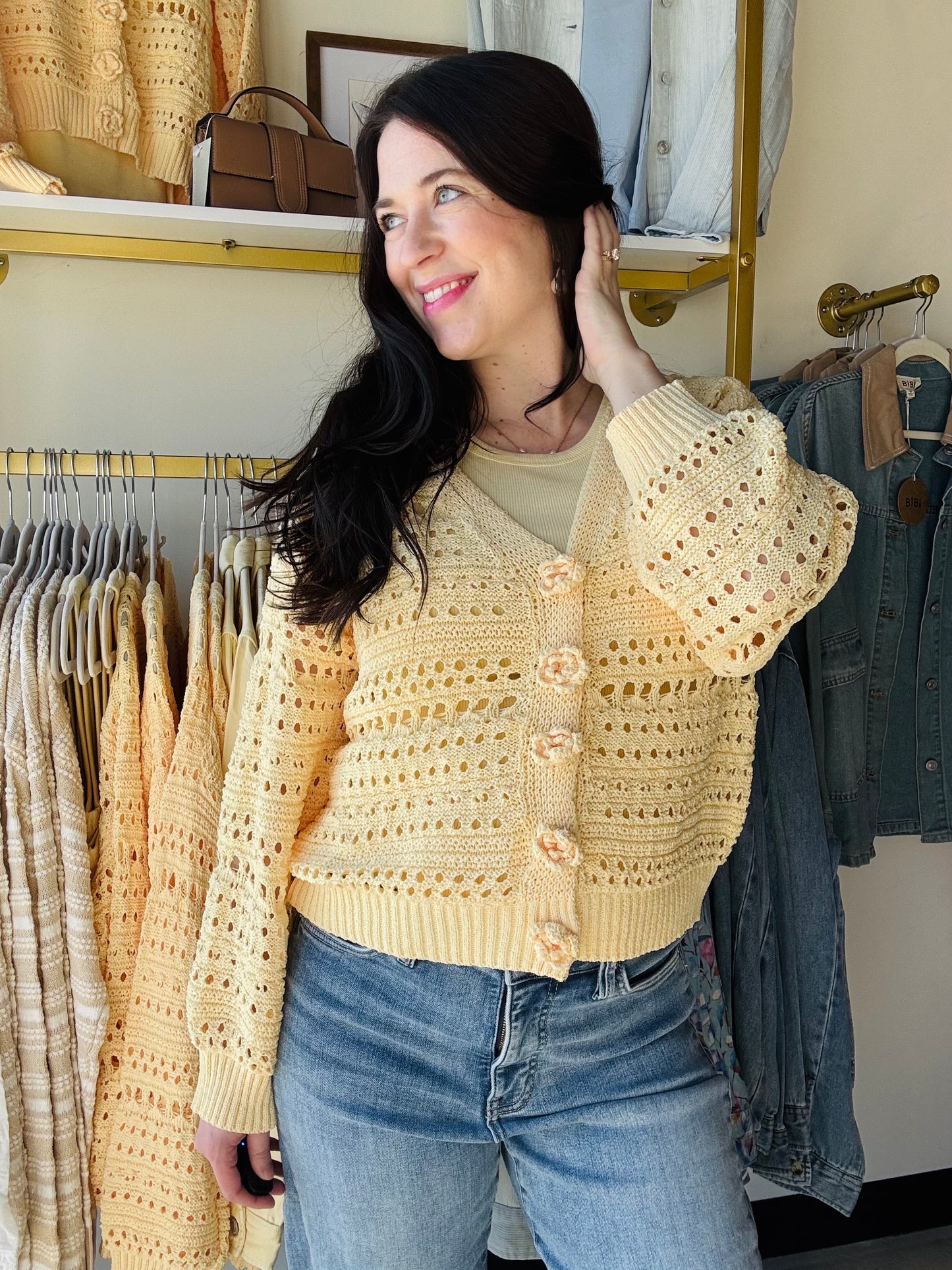 POL

A soft, open-knit sweater cardigan designed for effortless layering. It features uniquely handcrafted 3D floral buttons that serve as the key focal point. The silhouette is relaxed and easy without leaning too oversized, offering a comfortable and flattering fit.

--------------------------------------------------------------------------

Fabric Contents:

-&nbsp;100% POLYESTER

--------------------------------------------------------------------------

Specs/Dimensions:
- BUST: 22"
- LENGTH (Front and