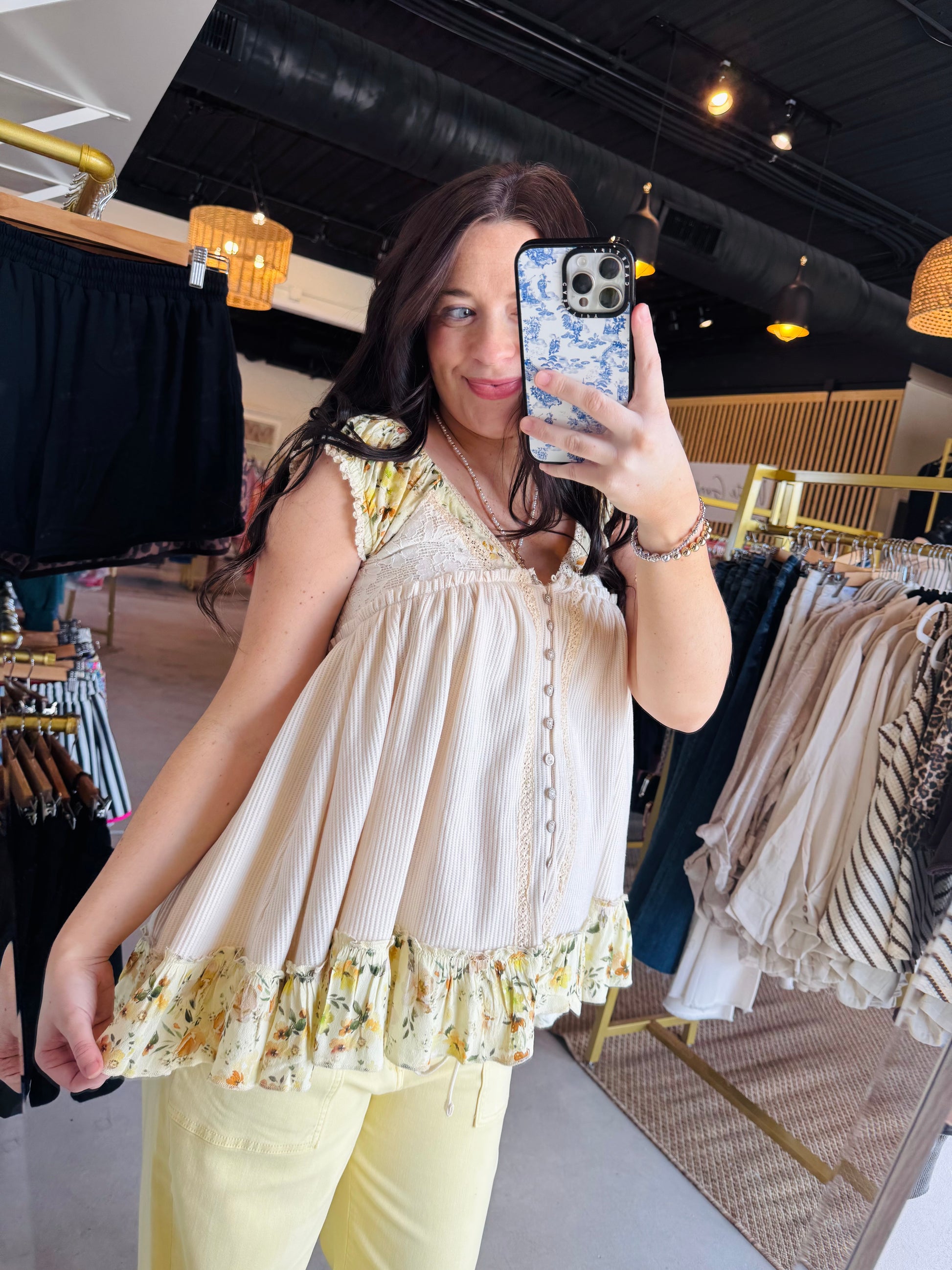 POL

Upgrade your basics with this ultra-soft thermal tank featuring delicate lace and vibrant yellow floral accents. The relaxed fit and feminine ruffle hem deliver effortless boho-chic style perfect for high-impact layering or stand-alone wear

Ultra-soft thermal fabric for all-day comfort.
Feminine lace and floral trim details.
Flattering relaxed fit for every body.
Effortlessly pairs with denim or skirts.
Perfect for year-round layering potential.
Playful contrast ruffle hem finish.

