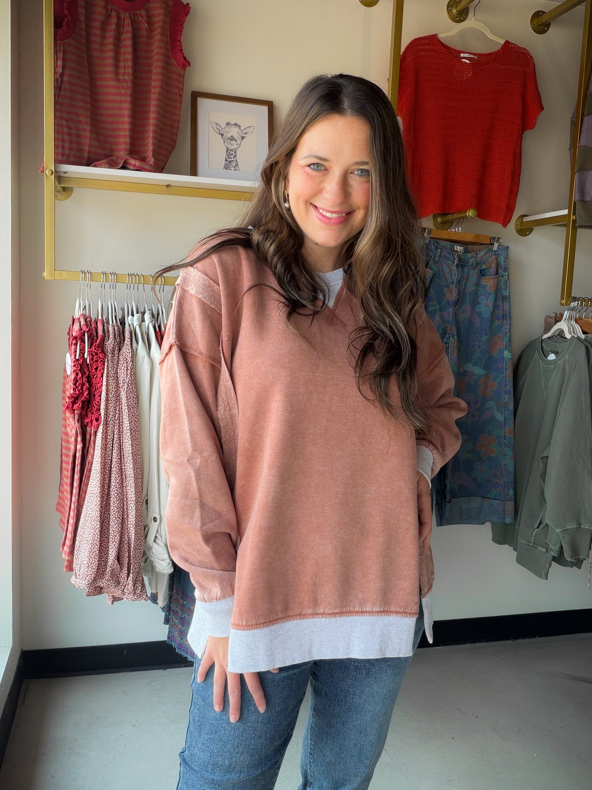 Bold color meets effortless comfort. The&nbsp;Acid Wash Pullover by Zenana is a cozy fleece pullover with serious personality. The rich rust hue gets an artisan edge from the acid wash treatment, meaning every piece is one-of-a-kind — no two are exactly alike. Contrast trim detailing and side slits add thoughtful finishing touches that keep it feeling fresh and fashion-forward.

Made from a soft cotton-poly fleece blend, it's the kind of pullover you'll live in all season long. Oversized and relaxed, it pai