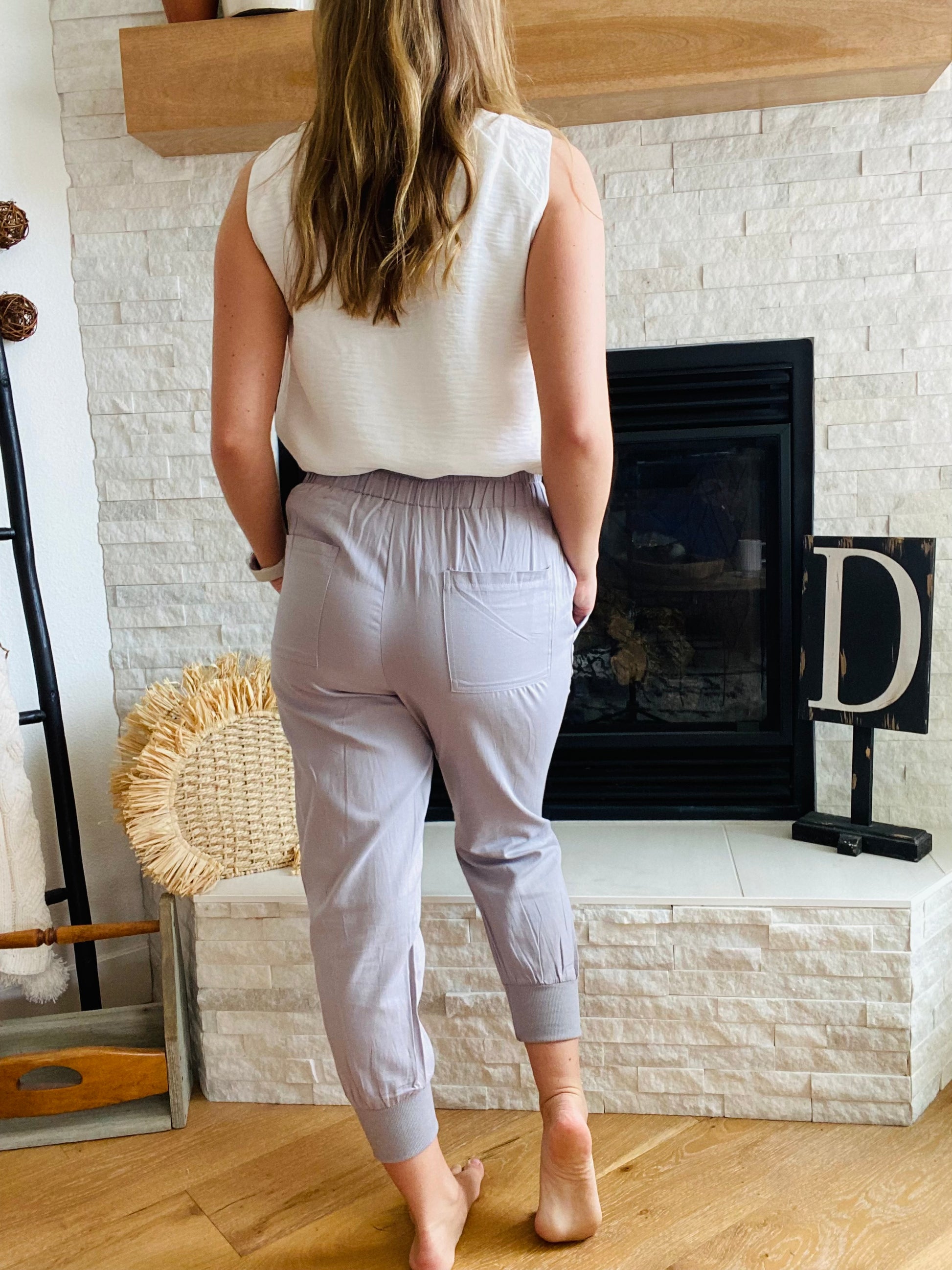 Our Grey Casual Vibes Joggers have a stylish, tapered cut that features pockets, allowing you to easily access your essentials. Whether you want to dress them up or down, they'll be perfect for both casual and business settings. Pair them with sandals and a blazer for a smart, put-together look.