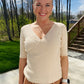This Apricot Rib Knit Half Sleeve Top easily adapts to any occasion. With its classic style and ribbed fabric, it ensures unbeatable comfort. The unique criss cross hemline provides a unique touch, while its versatile size allows for tucking or leaving it untucked. Enjoy effortless chic style.