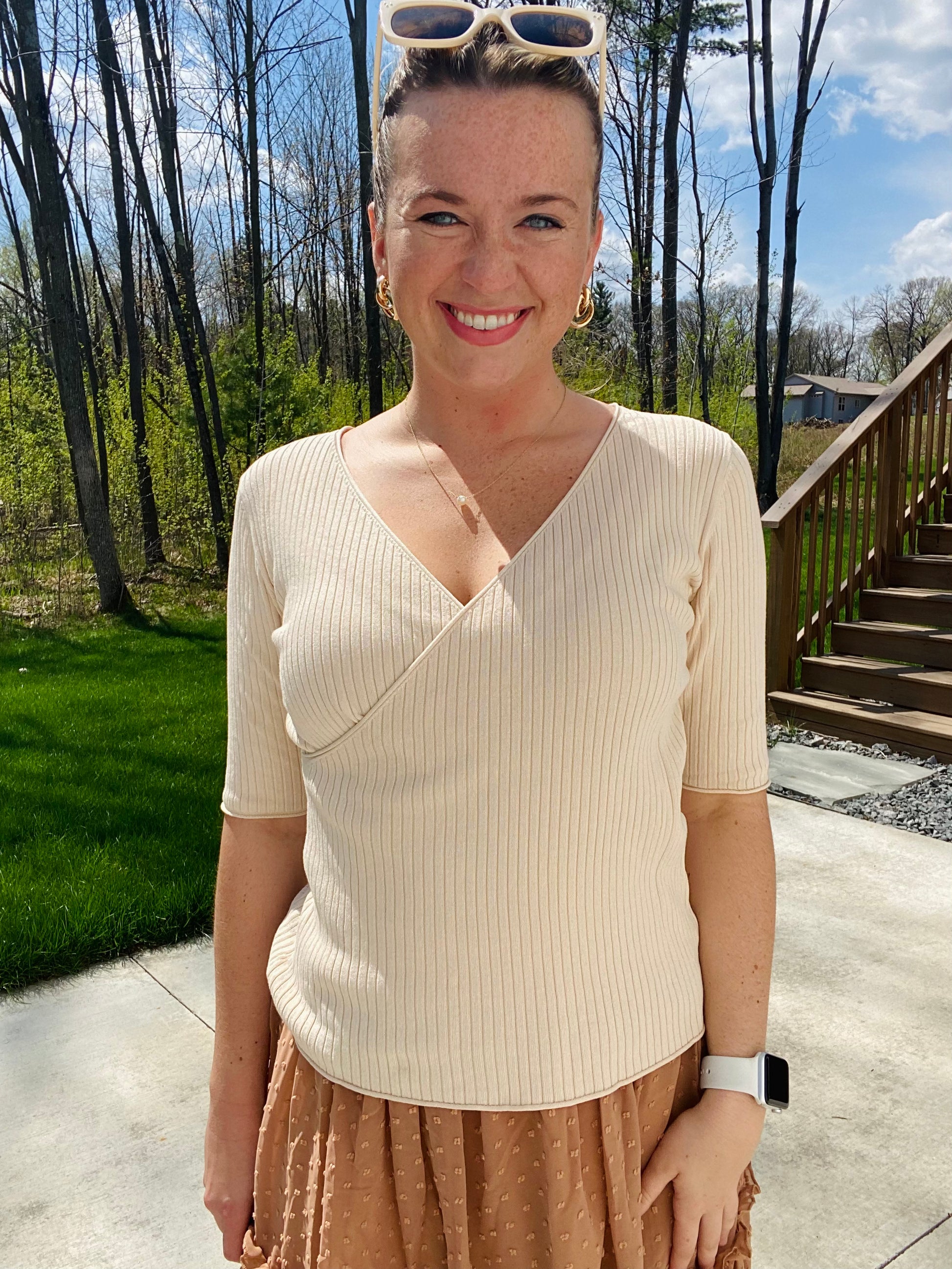 This Apricot Rib Knit Half Sleeve Top easily adapts to any occasion. With its classic style and ribbed fabric, it ensures unbeatable comfort. The unique criss cross hemline provides a unique touch, while its versatile size allows for tucking or leaving it untucked. Enjoy effortless chic style.