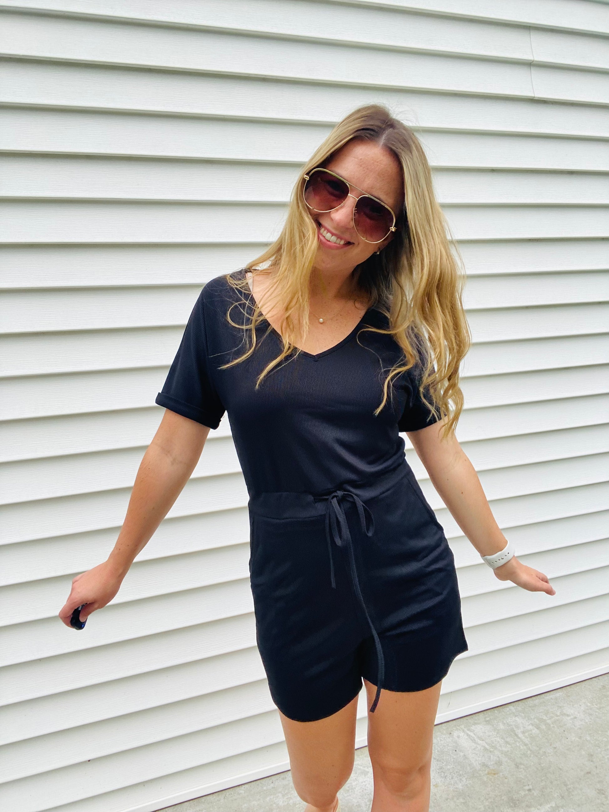 This Black Ribbed Abby Romper offers all-day comfort and style. Made of a lightweight fabric, it features a drawstring waistband, scoop neck neckline, and a casual, cute look. Perfect for pairing with a blazer or jean jacket and sneakers. Enjoy effortless style and comfort.