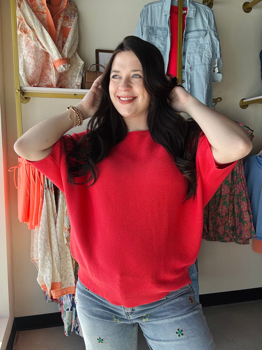 Wishlist&nbsp;

Effortless style meets comfort in this vibrant papaya dolman sleeve sweater. The relaxed, flowing silhouette flatters every frame while keeping you cool during warmer months. Lightweight knit fabric drapes beautifully from the generous dolman sleeves, creating an elegant, understated look. Perfect for layering or wearing solo—a versatile piece that transitions seamlessly from season to season.