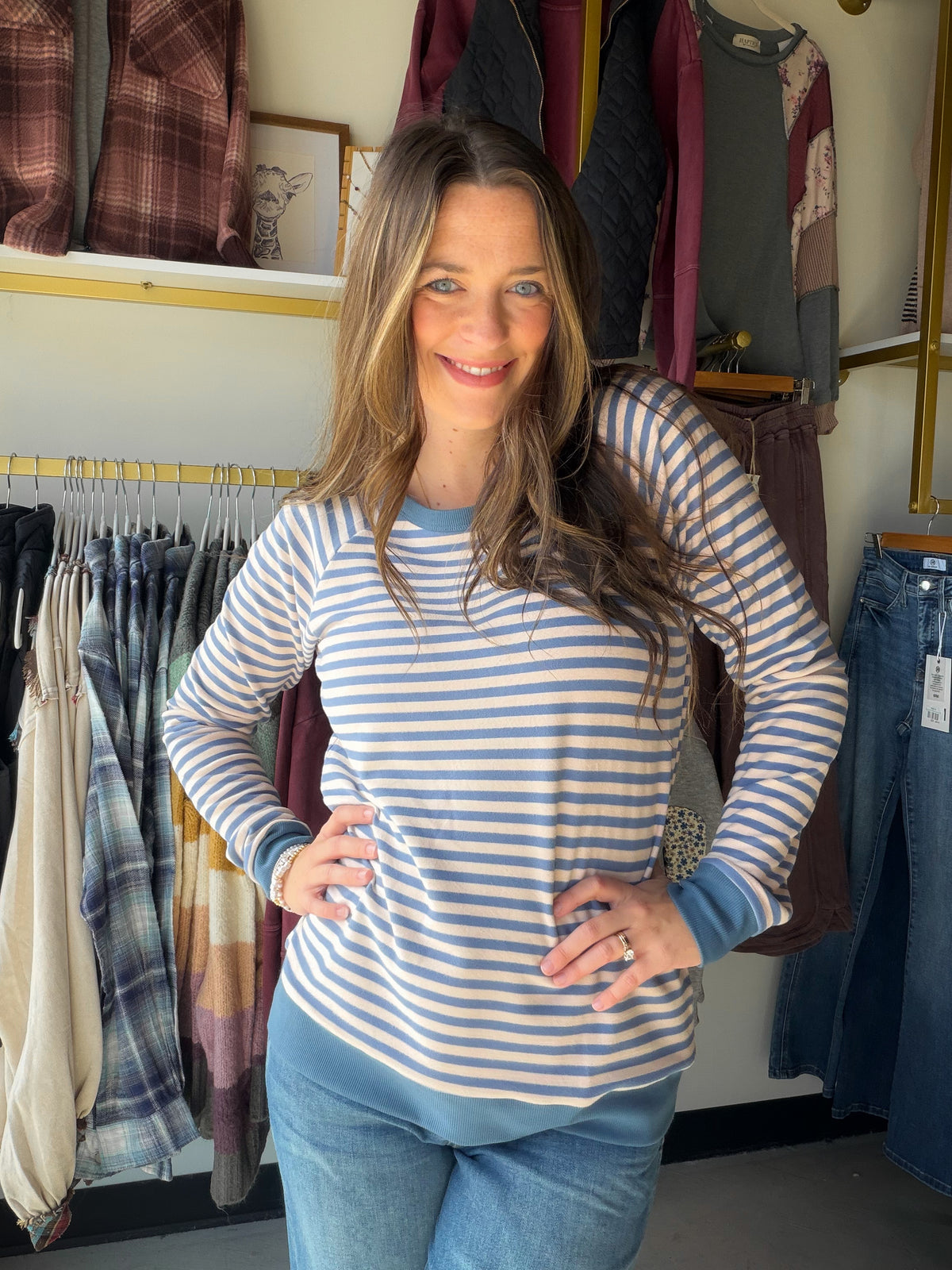 Some days call for a little color with your comfort. The Blue &amp; Pink Stripe Brushed Pullover by Staccato brings cheerful stripes to a casual sweatshirt silhouette. Its crew neck and long raglan sleeves make it an easy choice with denim for coffee runs, weekend plans, and everything in between.

Details to love

Blue and pink striped design.
Crew neckline and long raglan sleeves.
Rayon terry fabric, as listed in the existing product details.
Fabric blend: 45% cotton, 44% rayon, 11% spandex.
Fit &amp; sty
