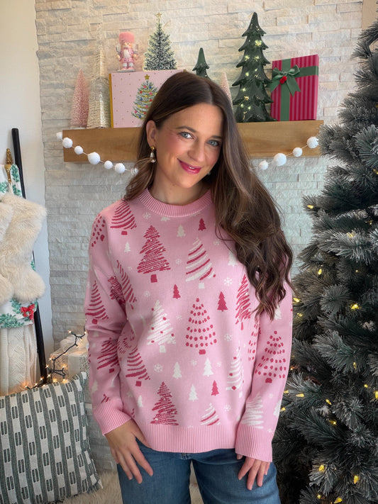 Christmas Cheer with a Pink Twist

Bring a playful touch to sweater season with the Pink Jacquard Tree Sweater by Staccato. A Christmas tree jacquard design gives this pink sweater its festive personality, while the classic crew neckline and long sleeves make it easy to style for your favorite holiday traditions.

The thick knit brings that bundled-up feeling to chilly-day outfits. Picture a mug of hot cocoa, an afternoon decorating the tree, and this sweater paired with your favorite jeans. It’s a cheerful