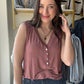 Be prepared for a great time under the sun with our Brick V Neck Button Tank. This sleeveless V-neck henley top is ideal for casual outings and is made from a comfy knit fabric. The addition of button detailing gives it a charming touch.