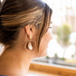 Georgia is a statement dangle style that perfectly combines metals with acrylics and will add the perfect pop to your look.  18K gold-plated hypoallergenic stainless steel posts 12mm posts Alloy metal circle charms Lightweight and durable acrylic charms in brown shimmer