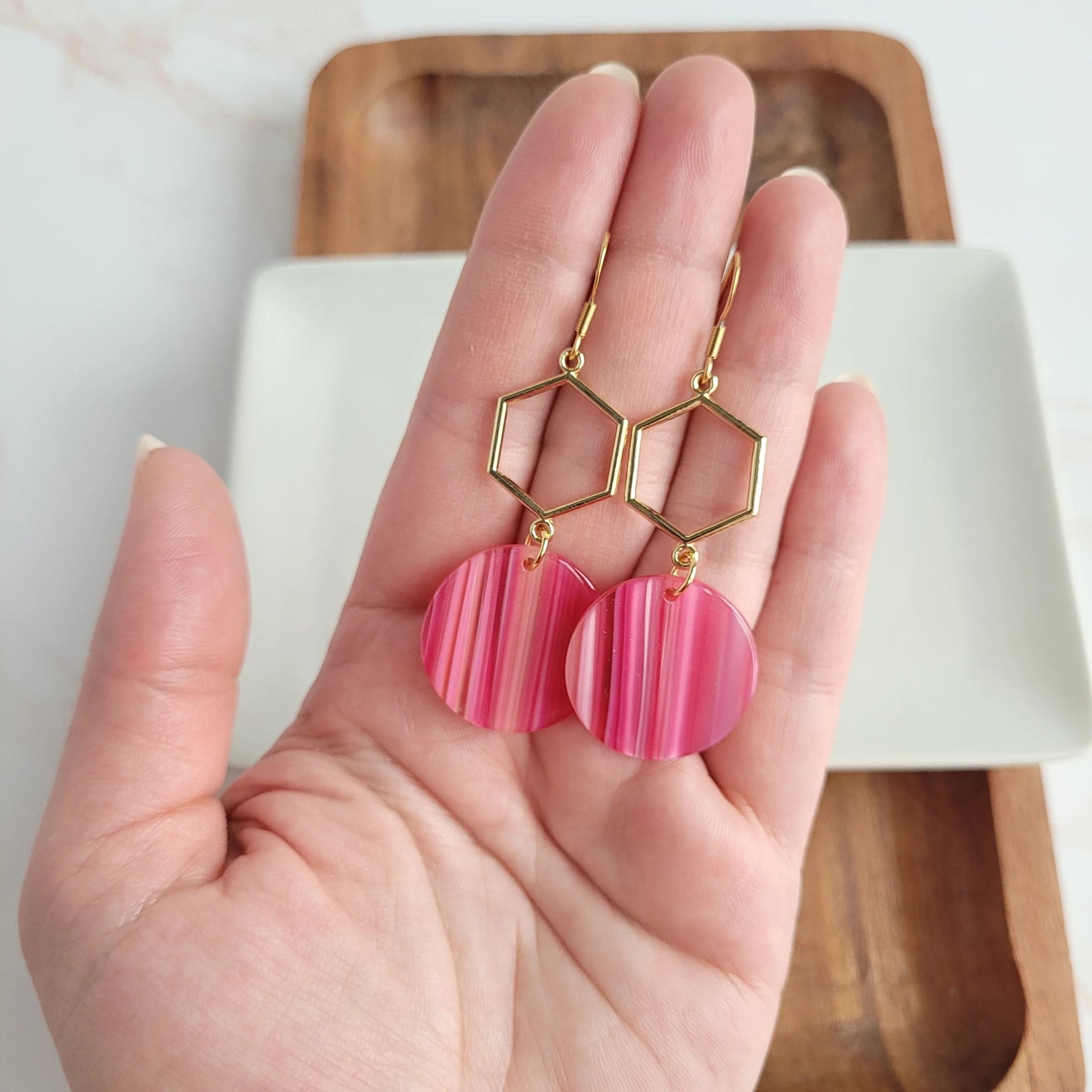 Flaunt your sophistication with a perfect pair of Layla Earrings! Our gold hexagon accent and beautiful acrylic will instantly elevate any outfit - getting you ready to take on the day like a boss. Put ‘em on, and watch the compliments roll in! (And you thought hexagons were just for math class.)