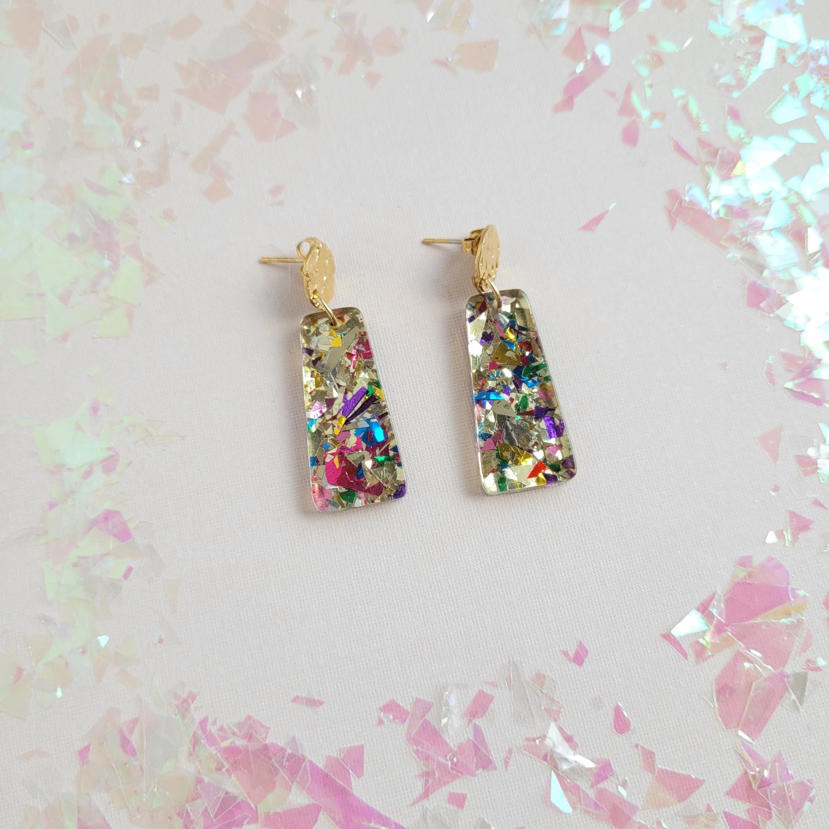 Our Mia Mini Earrings feature a fun pop of color with gold stud accents. These dainty earrings make the perfect finishing touch to any outfit, while still being small and delicate enough to wear every day.  18K gold-plated hypoallergenic stainless steel posts 10mm posts Lightweight and durable plant-based acrylic