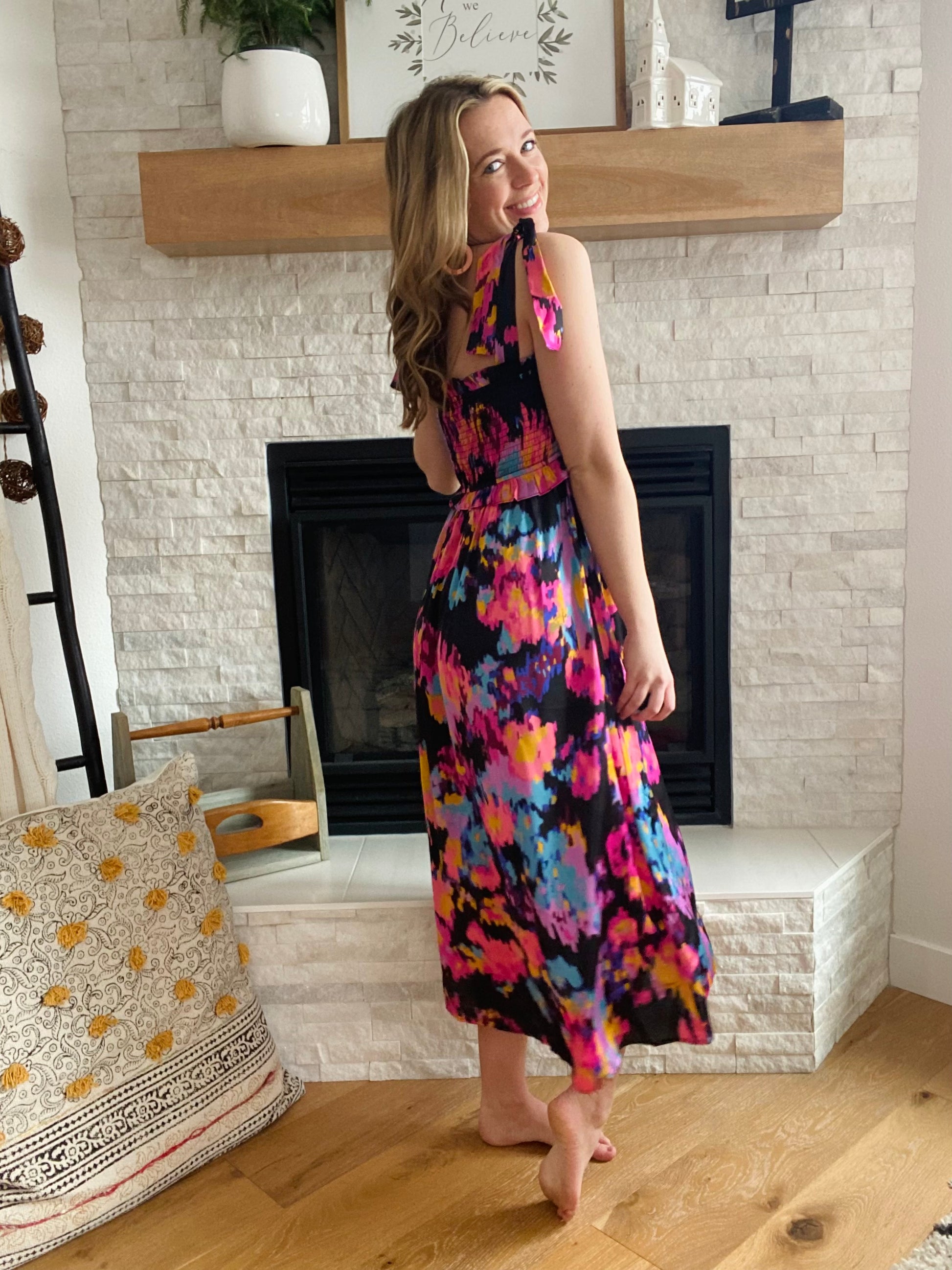 This dress screams tropical vacation and drinks with your girlfriends! The vibrant color palette is a breath of fresh air after a long winter. It fits true to size with a stretchy bodice. 