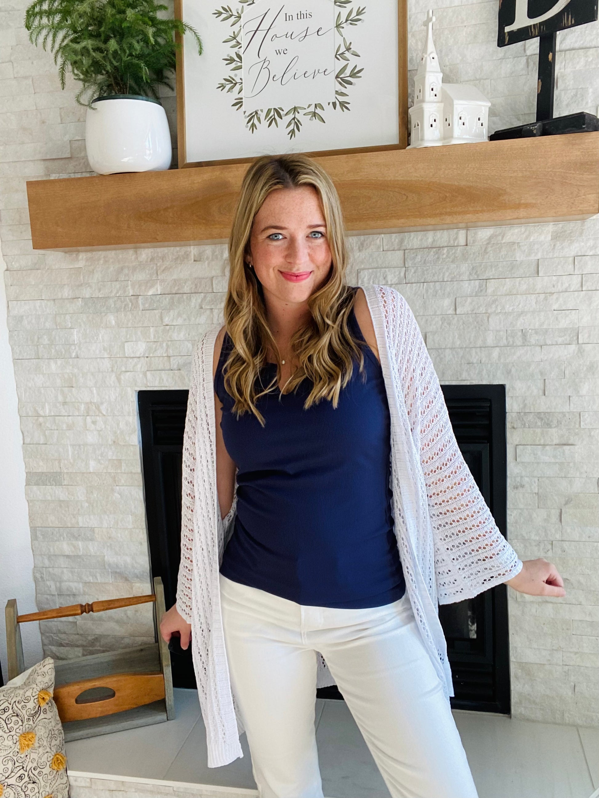 This Navy Split Neck Ribbed Tank Top offers a unique neckline and ribbed material for a comfortable fit. The navy blue classic color makes this top ideal for layering and can be easily paired with other garments. Enjoy this simple yet stylish piece. This tank top features a 95% Polyester, 5% Spandex blend that offers a true to size fit. Model is 5'4" and is wearing a small.